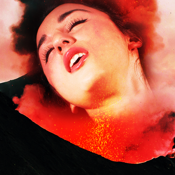 woman leans back head in ecstasy